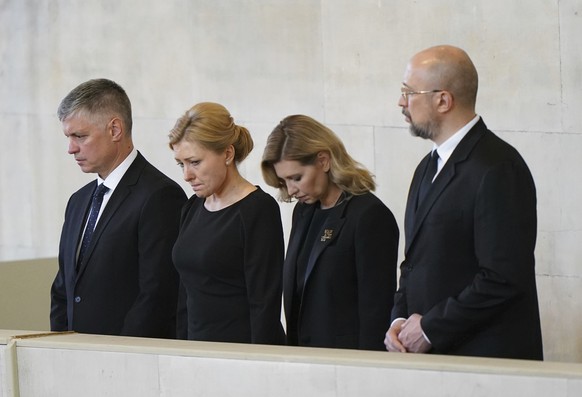 Ukrainian Ambassador to the UK Vadym Prystaiko, left, and First Lady of Ukraine Olena Zelenska, second right, view the coffin of Queen Elizabeth II, lying in state on the catafalque in Westminster Hal ...