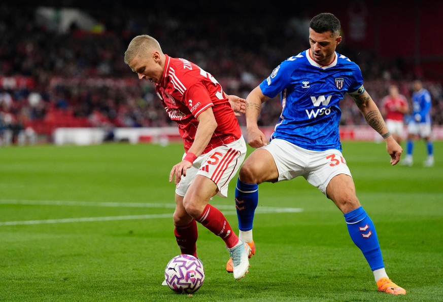 Nottingham Forest&#039;s Oleksandr Zinchenko, left, and Sunderland&#039;s Granit Xhaka in action during the English Premier League soccer match between Nottingham Forest and Sunderland at the City Gro ...