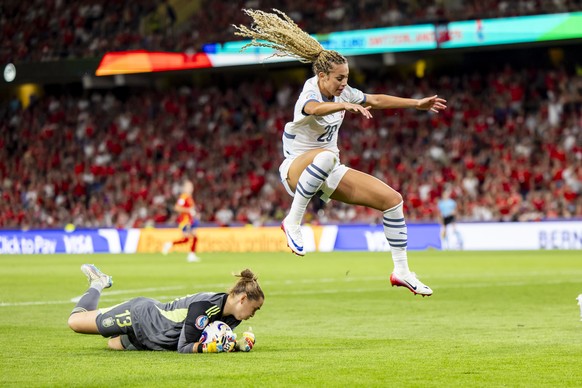 Spain&#039;s goalkeeper Catalina Coll, left, fights for the ball with Switzerland&#039;s Alayah Pilgrim, right, during the UEFA Women&#039;s EURO 2025 quarterfinals soccer match between Spain and Swit ...