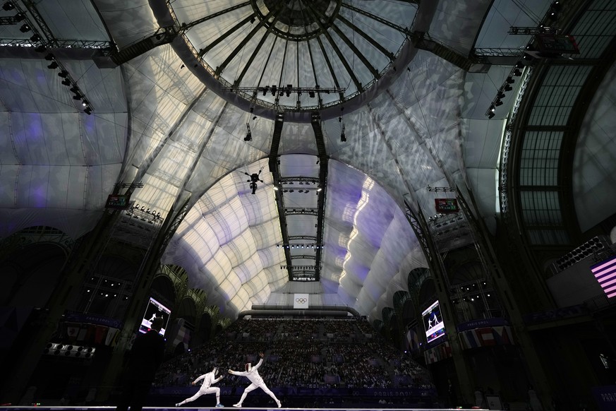 Czech Republic&#039;s Jiri Beran, left, competes with France&#039;s Yannik Borel in the men&#039;s team epee bronze final match during the 2024 Summer Olympics at the Grand Palais, Friday, Aug. 2, 202 ...