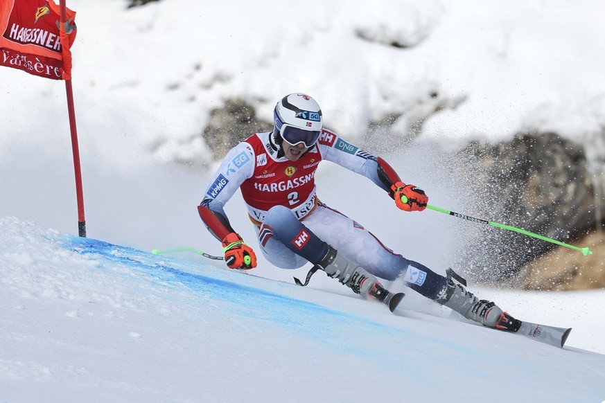 Norway's Henrik Kristoffersen speeds down the course during the first run of an alpine ski, men's World Cup giant slalom in Val d'sere, France, Saturday, Dec. 9, 2023. (AP Photo/Marco T ...
