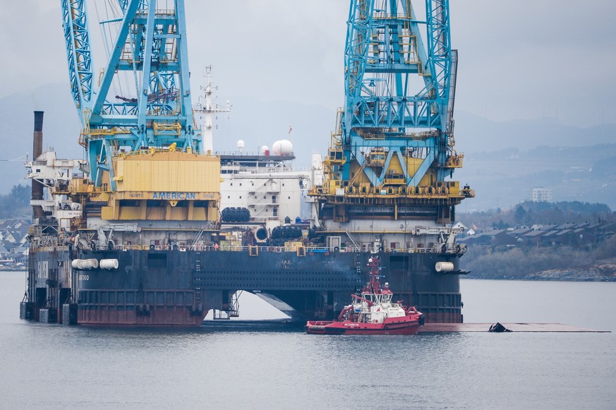 epa09889528 A semi-submersible crane vessel was overturned after a steel wire broke during a lifting operation in the fjord outside Stavanger, Norway, 14 April 2022. The 275 people on board were not i ...