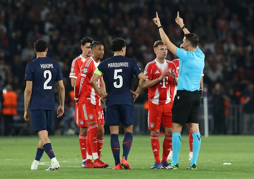 PARIS, FRANCE - APRIL 28: Joshua Kimmich of FC Bayern Munich reacts towards Referee Sandro Schaerer during the UEFA Champions League 2025/26 Semi Final First Leg match between Paris Saint-Germain and  ...