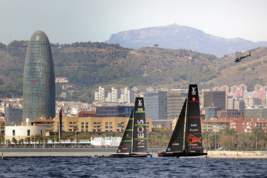 epa11608212 Alinghi Red Bull Racing (R) of Switzerland and INEOS Britannia of Britain compete on the third day of the Louis Vuitton Cup Semi-Finals within the America's Cup sailing competition, i ...