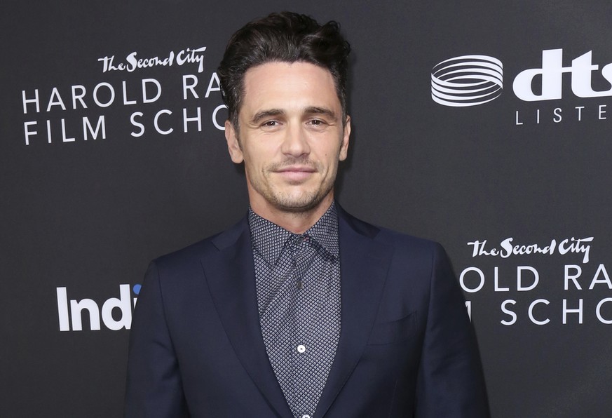 FILE - James Franco arrives at IndieWire Honors on Nov. 2, 2017, in Los Angeles. Franco and his co-defendants have agreed to pay $2.2 million to settle a lawsuit alleging he intimidated students at an ...