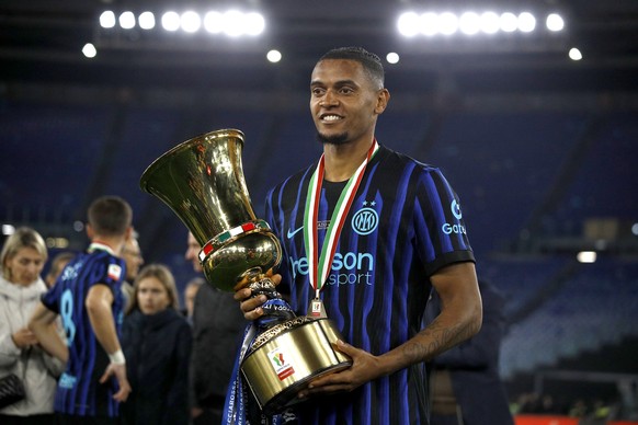ROME, ITALY - MAY 13: Manuel Akanji of FC Internazionale celebrates the victory with the trophy ,after the Coppa Italia Final match between SS Lazio and FC Internazionale at Stadio Olimpico on May 13, ...