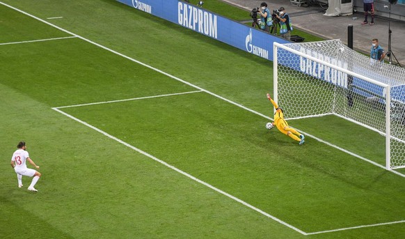 France&#039;s goalkeeper Hugo Lloris saves a penalty taken by Switzerland&#039;s Ricardo Rodriguez, left, during the Euro 2020 soccer championship round of 16 match between France and Switzerland at N ...