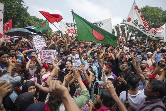 Activists take part in a protest march against Prime Minister Sheikh Hasina and her government to demand justice for more than 200 people killed in last month&#039;s violent demonstrations, in Dhaka,  ...