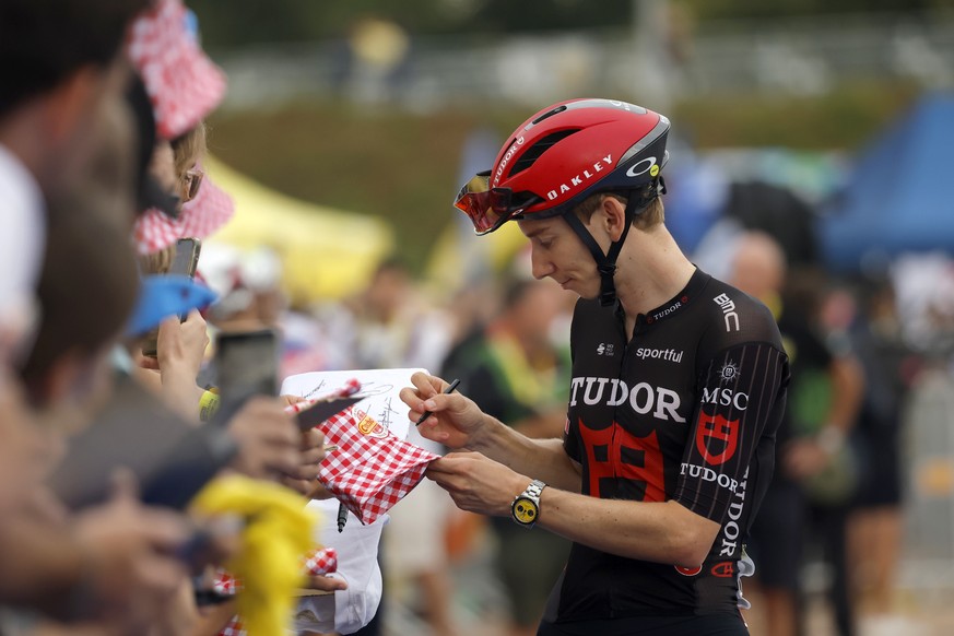 epa13112511 Swiss cyclist Yannis Voisard of Tudor Pro Cycling Team signs autographs at the signature sign-on ahead of Stage 11 of the Tour de France, a 161.3 km route from Vichy to Nevers, France, 15  ...