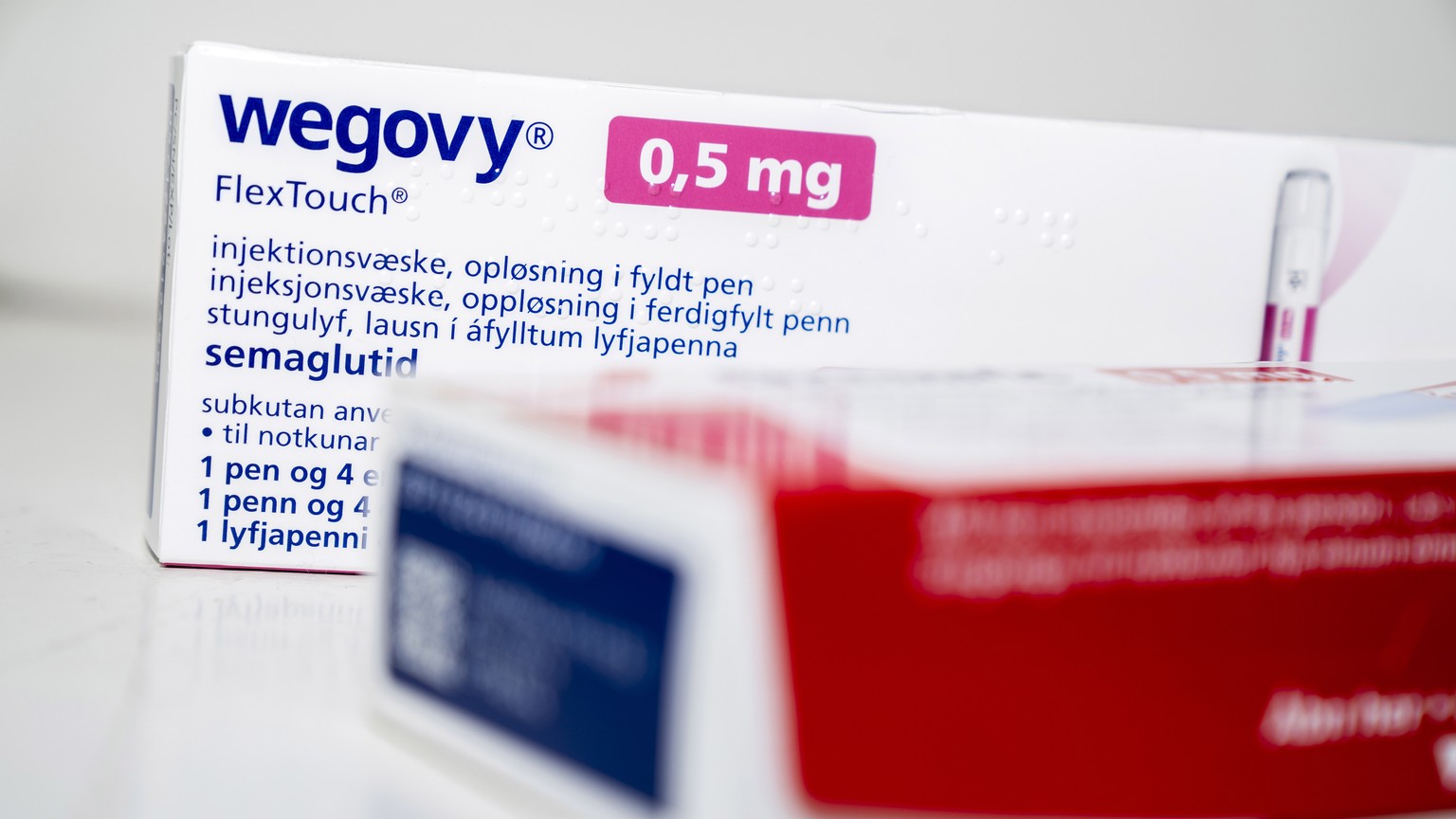 epa10538870 Packages of prescribtion drugs Ozempic and Wegovy by Novo Nordisk sit on a table in Copenhagen, Denmark, 23 March 2023. US celebrities have credited their weight loss to the FDA-approved m ...