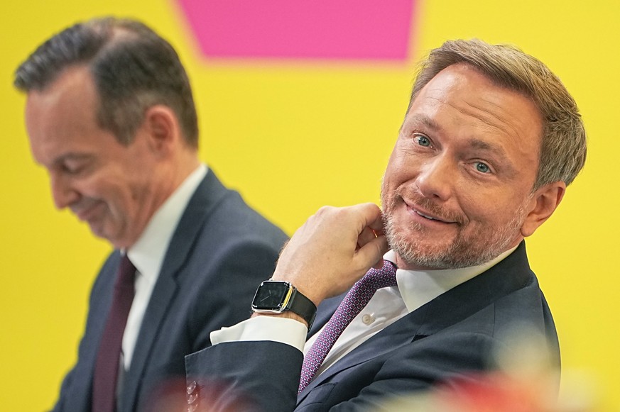 Christian Lindner, foreground, party leader of the Free Democratic Party, and Volker Wissing, FDP secretary general address a convention of the party prior to deciding to approve a deal to form a new  ...