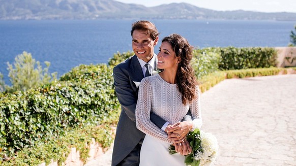 epa07937506 A handout photo made available by Rafa Nadal Foundation shows Spanish tennis player Rafa Nadal (L) and his wife Mery Perello (R) during their wedding in sa Fortalesa, Pollenca, Balearics,  ...