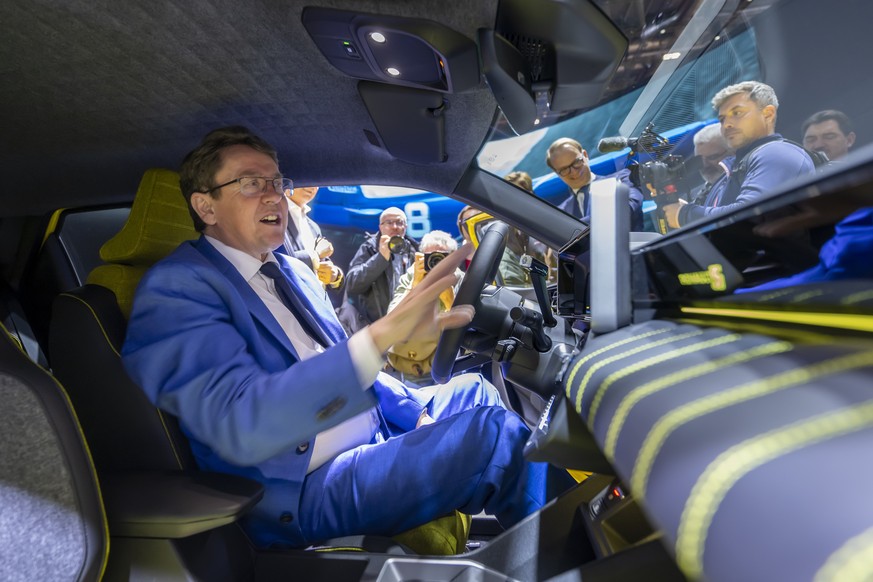 epa11184451 Switzerland&#039;s Transport, Environment, Energy and Communications Minister Federal Councillor Albert Roesti inside a Renault R5 E-Tech electric car, during the opening ceremony of the 9 ...