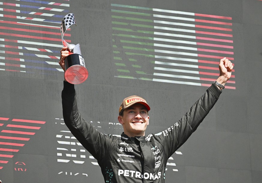 Mercedes driver George Russell, of the United Kingdom, celebrates his win following the Formula One auto racing Canadian Grand Prix in Montreal, Sunday, June 15, 2025. (Graham Hughes/The Canadian Pres ...