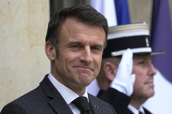 FILE - French President Emmanuel Macron waits on the steps of the Elysee Palace, Monday, March 11, 2024 in Paris. On Friday, May 10, 2024, The Associated Press reported on stories circulating online i ...