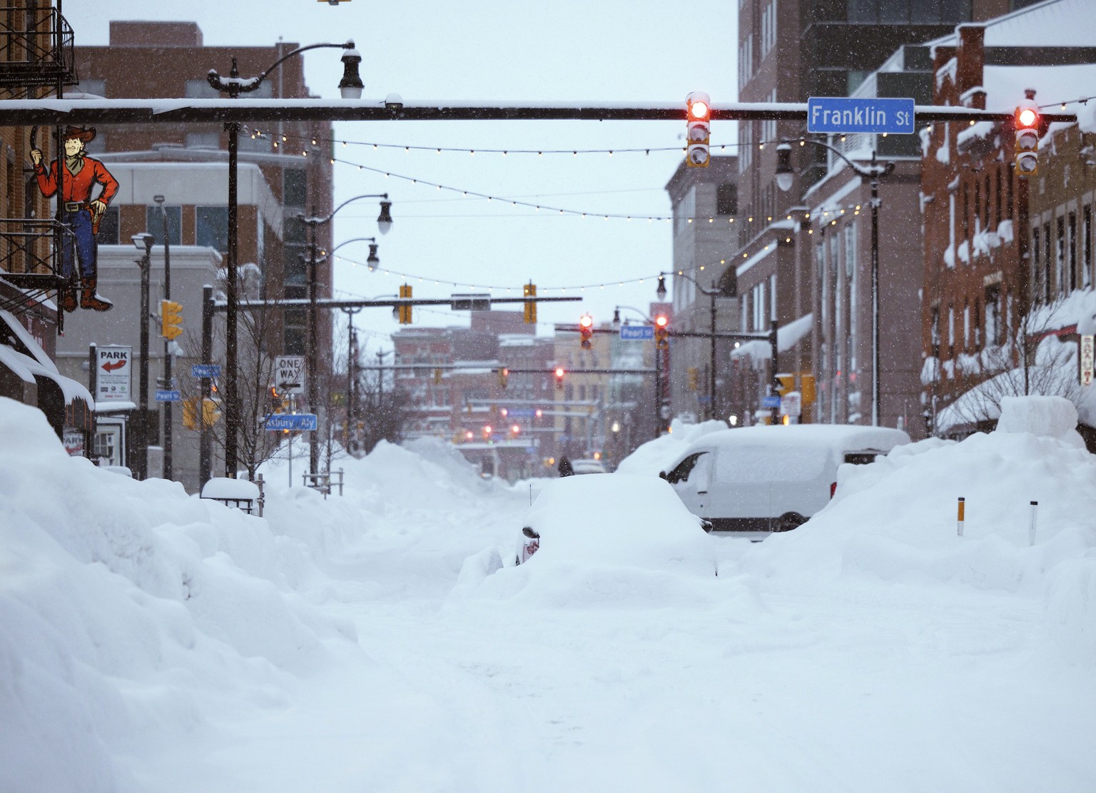 This photo provided by the Twitter page of New York Gov. Kathy Hochul, snow from this weekends blizzard covers downtown Buffalo on Monday, Dec. 26, 2022. The blizzard roared through western New York F ...