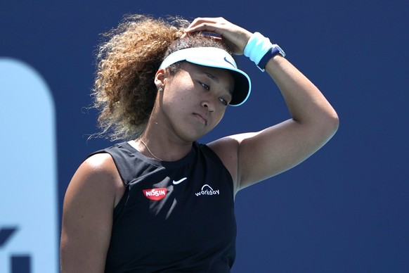 FILE - Naomi Osaka, of Japan, reacts during her match against Maria Sakkari, of Greece, in the quarterfinals of the Miami Open tennis tournament in Miami Gardens, Fla., in this Wednesday, March 31, 20 ...