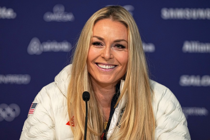 FILE - United States' Lindsey Vonn smiles during a press conference by the U.S. ski team at the 2026 Winter Olympics, in Cortina d'Ampezzo, Italy, Tuesday, Feb. 3, 2026. (AP Photo/Fatima Shb ...