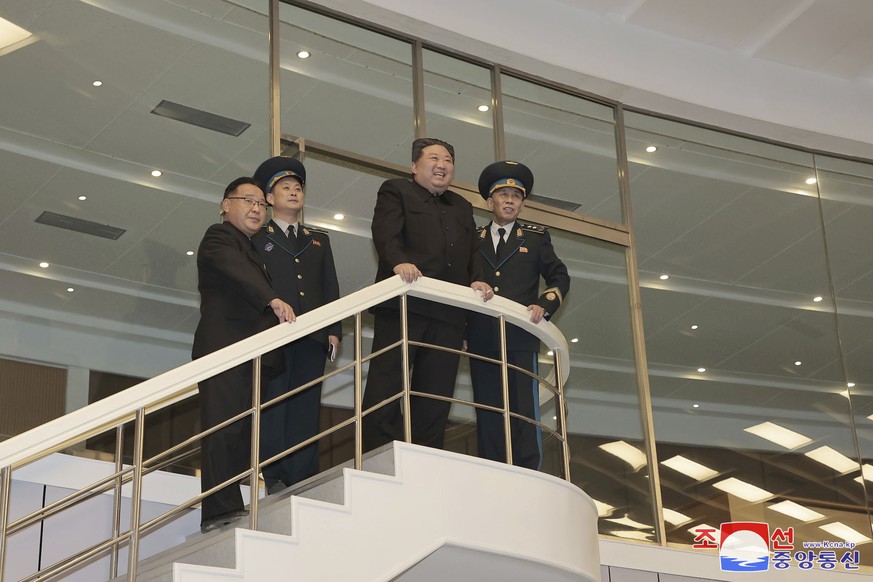 In this photo provided by the North Korean government, North Korean leader Kim Jong Un watches conditions of a satellite at a satellite control center in Pyongyang, North Korea, Wednesday, Nov. 22, 20 ...
