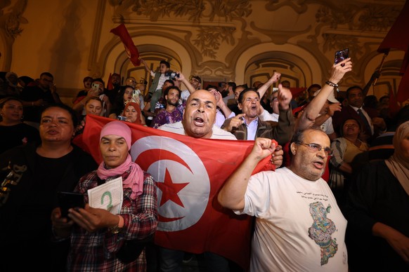 epa11646351 Supporters of Tunisian presidential candidate Kais Saied celebrate after unofficial results of the Tunisian presidential election in the capital Tunis, Tunisia, 06 October 2024. Tunisia&#0 ...