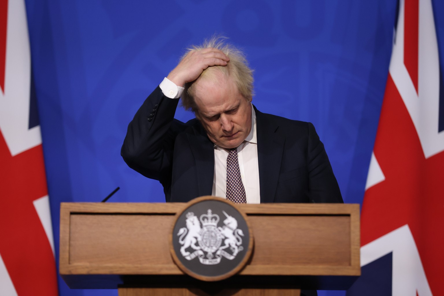 FILE - Britain&#039;s Prime Minister Boris Johnson gestures as he speaks during a press conference in London, Saturday Nov. 27, 2021, after cases of the new COVID-19 variant were confirmed in the UK.  ...