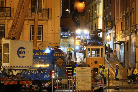 Cranes are positioned to remove the wreckage of a tourist streetcar that derailed and crashed in Lisbon, Thursday, Sept. 4, 2025. (AP Photo/Ana Brigida)
Portugal Streetcar Derailed