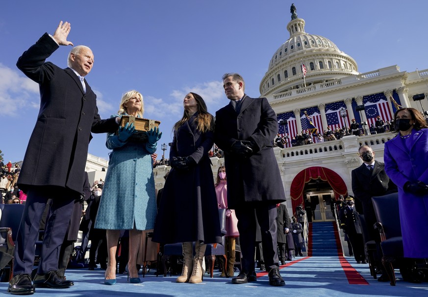 FILE - Joe Biden is sworn in as the 46th president of the United States by Chief Justice John Roberts as Jill Biden holds the Bible during the 59th Presidential Inauguration at the U.S. Capitol in Was ...
