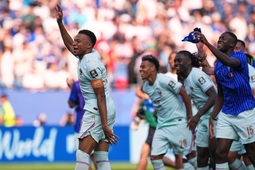 France's Kylian Mbappe, left, celebrates with teammates after France defeated Morocco during the World Cup quarterfinal soccer match between France and Morocco in Foxborough, Mass., near Boston,  ...