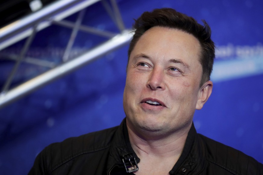 FILE - Tesla and SpaceX CEO Elon Musk arrives on the red carpet for the Axel Springer media award in Berlin on Dec. 1, 2020. A federal judge in California has dismissed a securities fraud and defamati ...