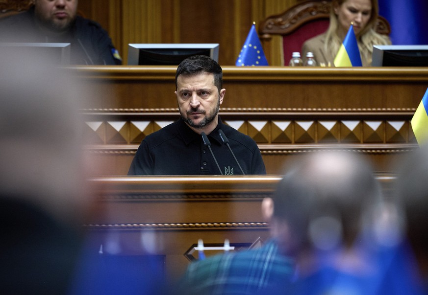 epa11662356 A handout picture made available by Ukraine&#039;s Presidential Press Service shows Ukrainian President Volodymyr Zelensky (C) addressing lawmakers in the Verkhovna Rada, the Ukrainian par ...