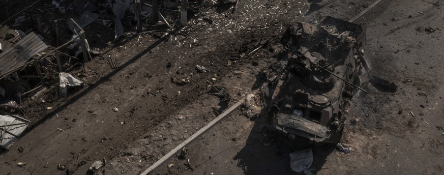 A destroyed Russian tank is seen after battles on a main road near Brovary, north of Kyiv, Ukraine, Thursday, March 10, 2022. (AP Photo/Felipe Dana)