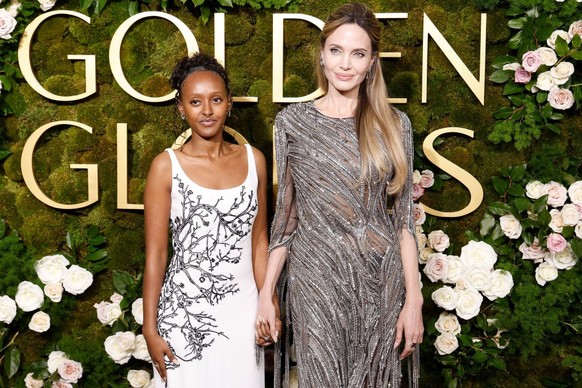 BEVERLY HILLS, CALIFORNIA - JANUARY 05: Zahara Jolie and Angelina Jolie attend the 2025 Golden Globe Awards at The Beverly Hilton on January 05, 2025 in Beverly Hills, California. (Photo by Taylor Hil ...