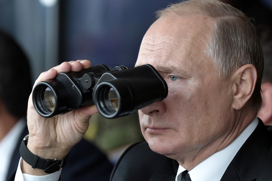 FILE - Russian President Vladimir Putin holds binoculars while watching the military exercises Center-2019 at Donguz shooting range near Orenburg, Russia, in Sept. 20, 2019. Russian President Vladimir ...