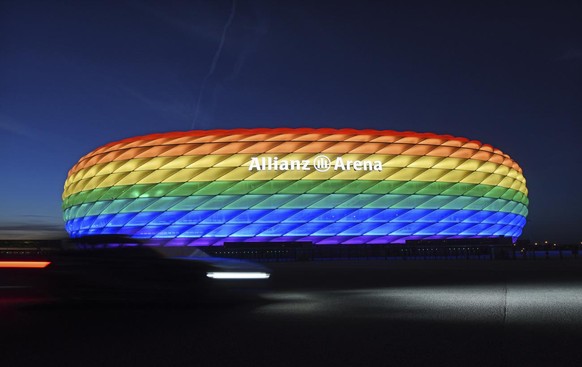 FILE - In this Saturday, July 9, 2016 file photo Munich&#039;s stadium is illuminated in rainbow colors on the occasion of Christopher Street Day in Munich, Germany. UEFA has declined the Munich city  ...