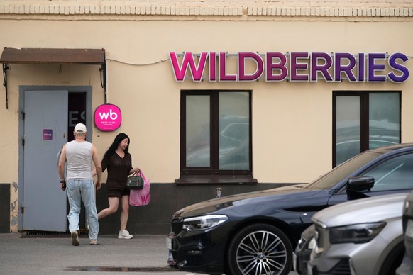 A woman carrying a package leaves an outlet of Russia's major online retailer Wildberries in Moscow on Wednesday, July 22, 2026. (AP Photo/Pavel Bednyakov)
Russia Ukraine Wildberries Explainer