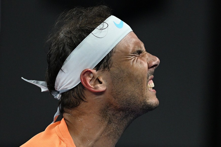 epa10412476 Rafael Nadal of Spain grimaces during his match against Mackenzie McDonald of the USA during the 2023 Australian Open tennis tournament at Melbourne Park in Melbourne, Australia, 18 Januar ...