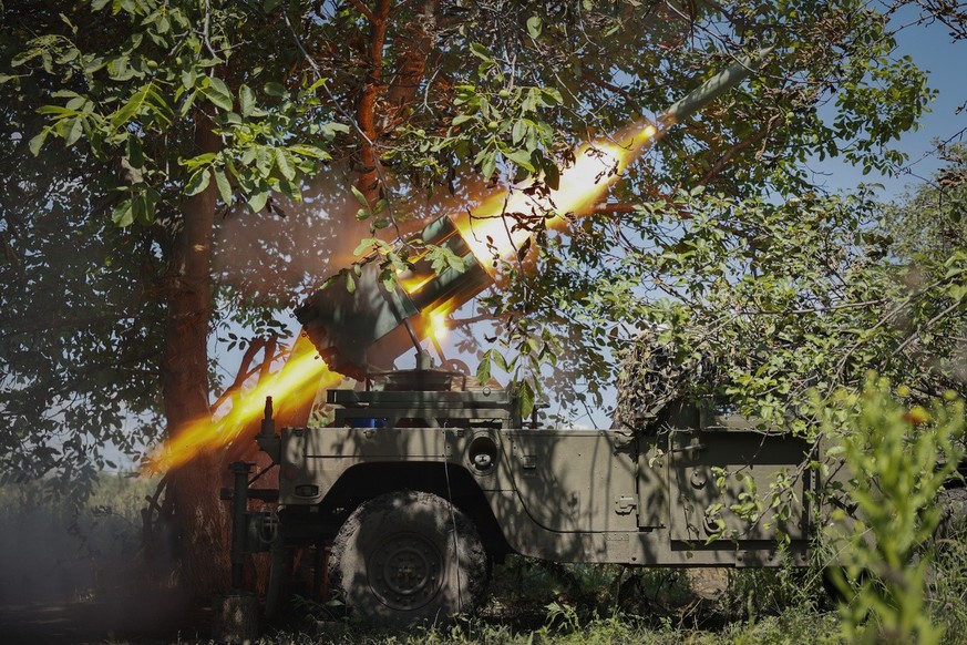 Ukrainian soldiers fire a Croatian RAK-SA-12 128mm multiple rocket launcher towards the Russian positions on the frontline near Bakhmut in the Donetsk region, Ukraine, Monday, July 10, 2023. Ukrainian ...