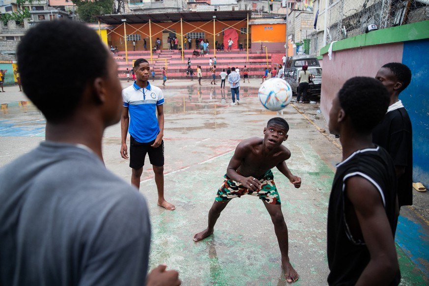 Children play football in Petion-ville, Port-au-Prince, Haiti, on March 20, 2026. (Photo by Clarens SIFFROY / AFP)