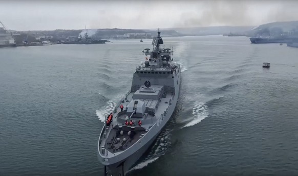 epa09712165 A frame grab taken from a handout video made available by the Russian Defence Ministry Press Service shows a Russian navy ship preparing to take part in exercises in the Black Sea, in Seva ...