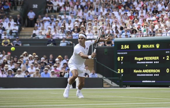 Switzerland&#039;s Roger Federer returns the ball to Kevin Anderson of South Africa during their men&#039;s quarterfinals match at the Wimbledon Tennis Championships, in London, Wednesday July 11, 201 ...