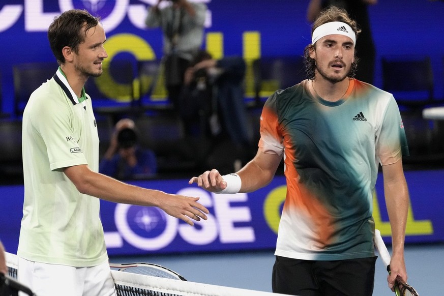Daniil Medvedev, left, of Russia is congratulated by Stefanos Tsitsipas of Greece following their semifinal match at the Australian Open tennis championships in Melbourne, Australia, Friday, Jan. 28,  ...