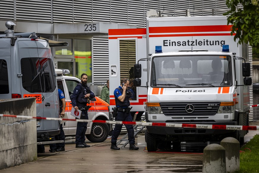 Police officers during an operation outside an after-school care facility in Zurich Oerlikon, Switzerland, on Tuesday, October 1, 2024. A 23-year-old man attacked a group of after-school children with ...