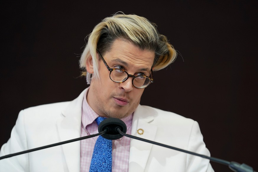 FILE - Activist Milo Yiannopoulos speaks during a rally outside of the Baltimore hotel where the United States Conference of Catholic Bishops are holding its Fall General Assembly meeting in Baltimore ...