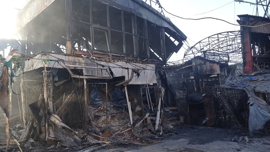 This March 2022 photo provided by zoologist Anton Vlaschenko shows the destroyed remains of a street market that was struck by Russian shelling in Kharkiv, Ukraine, close to the office of the Ukrainia ...