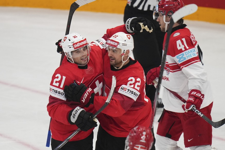 Switzerland&#039;s Kevin Fiala, left, and Nino Niederreiter celebrate after a goal during the semifinal match between Denmark and Switzerland at the ice hockey world championships in Stockholm,Sweden, ...