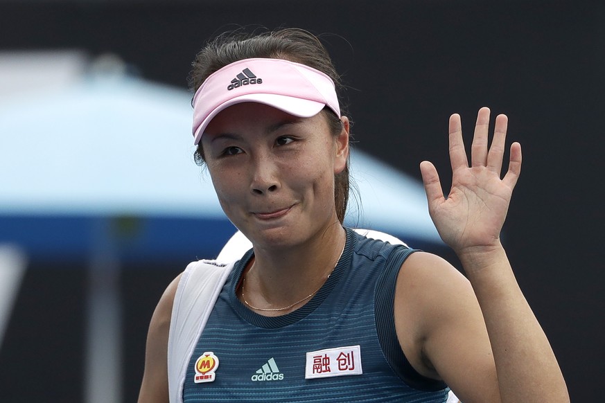 FILE - China's Peng Shuai waves after losing to Canada Eugenie Bouchard in their first round match at the Australian Open tennis championships in Melbourne, Australia on Jan. 15, 2019. Out of public v ...