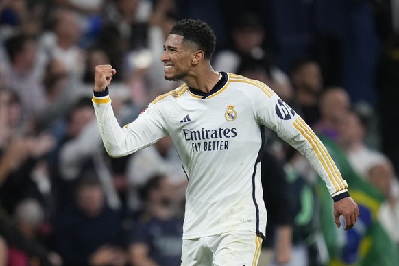 Real Madrid&#039;s Jude Bellingham celebrates at the end of the Spanish La Liga soccer match between Real Madrid and Barcelona at the Santiago Bernabeu stadium in Madrid, Spain, Sunday, April 21, 2024 ...
