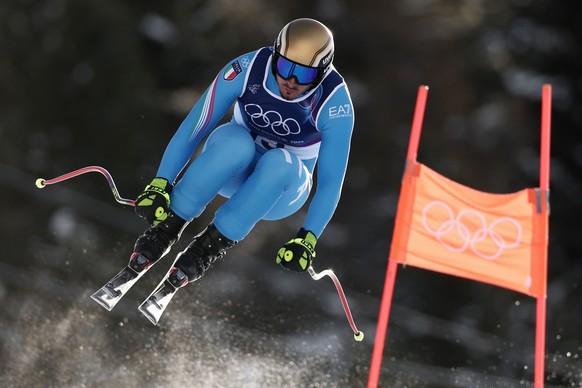 Italy's Dominik Paris speeds down the course during an alpine ski, men's downhill official training, at the 2026 Winter Olympics, in Bormio, Italy, Thursday, Feb. 5, 2026. (AP Photo/Gabriele ...