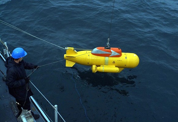 This undated photo made available by Marine Nationale shows PAP, an auto-powered marine robot, being downloaded to the sea from the mine hunter ship "Cassiopee," used to locate the fishing b ...