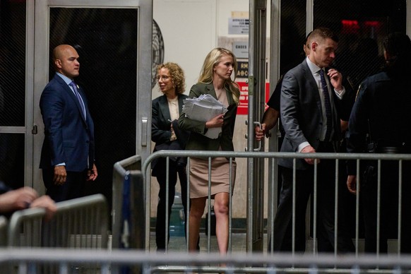 epa11288767 Natalie Harp (C), aide of former US President and current Republican presidential candidate Donald Trump, arrives to attend Trump's trial at Manhattan Criminal Court in New York, New  ...